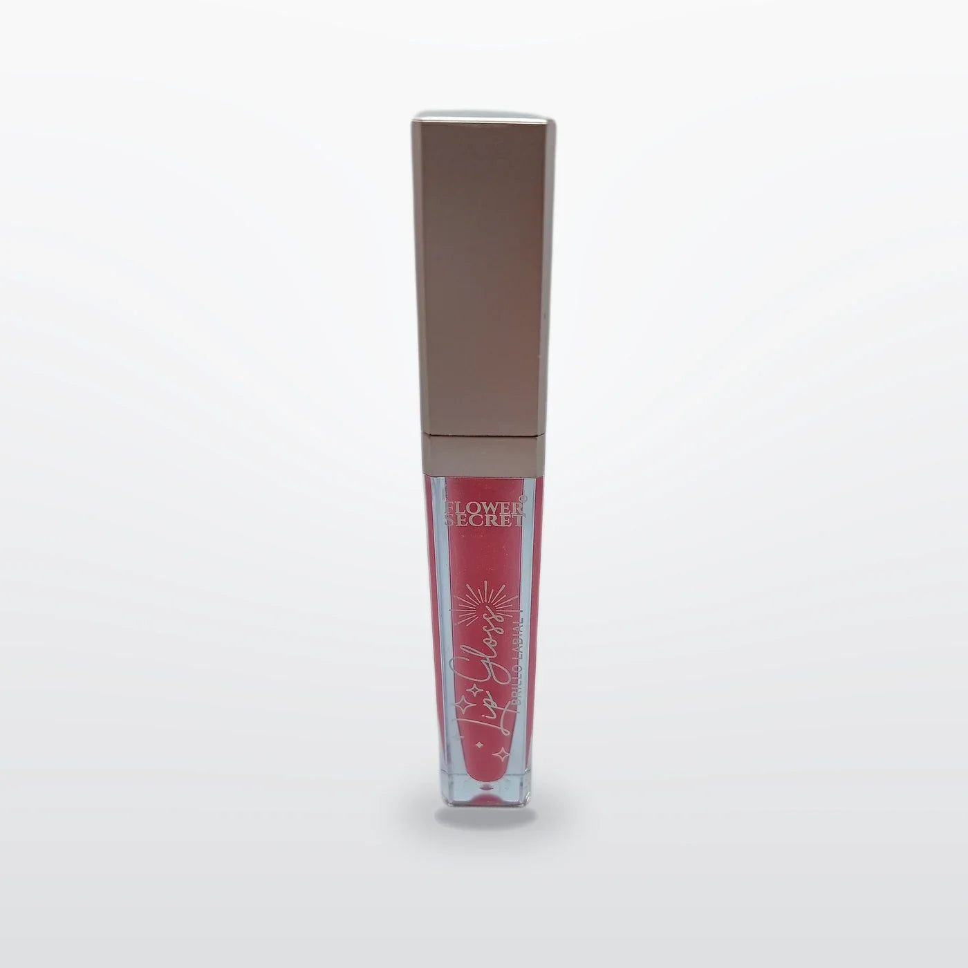 Brillo labial Flower Secret en tono rosa, envase transparente con tapa metalizada